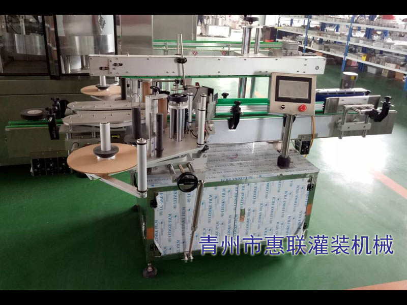 塑料桶貼標(biāo)機